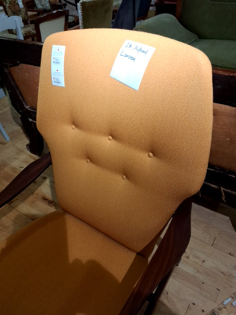 Lænestol i karrygul betræk af Ib Kofoed Larsen