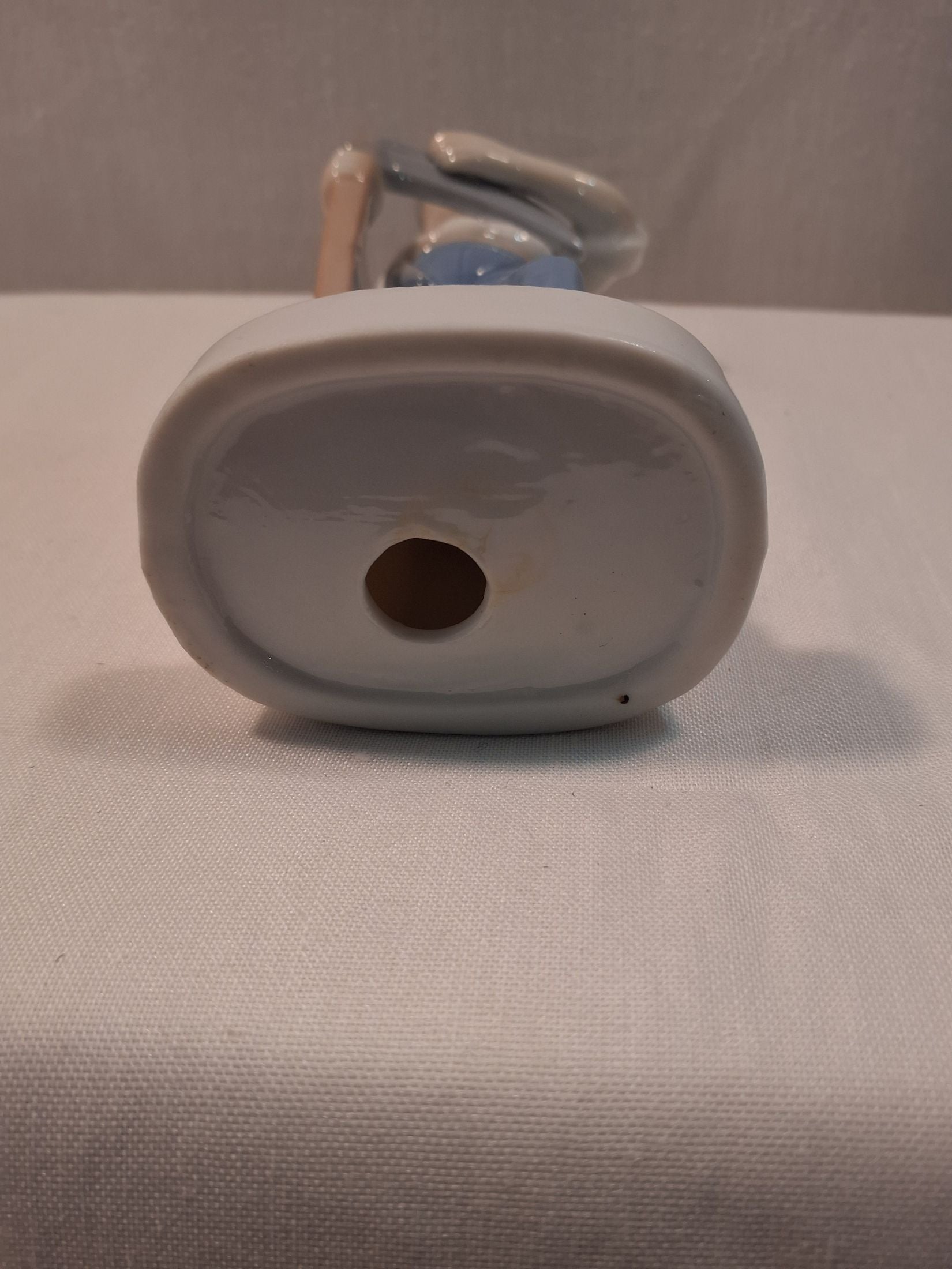 Porcelænsfigur mand med le.
