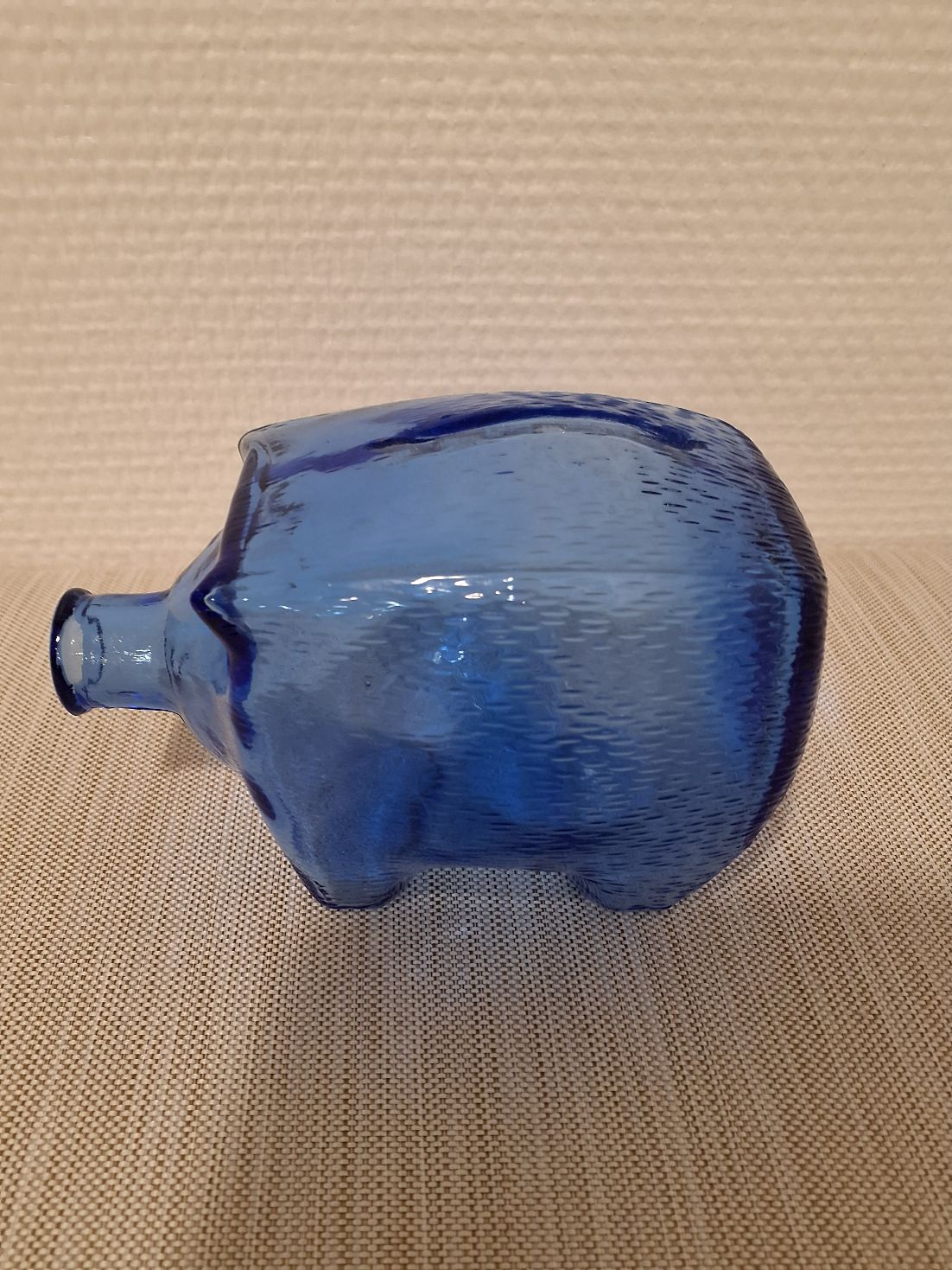 Blå sparegris i blå glas
