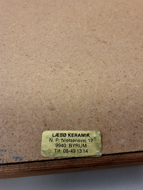 Relief i træramme