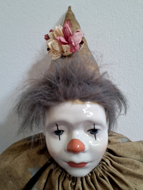 Pink-guld Harlekin dukke